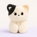 Miso the Kitten, a cream kitten plushie with a dark ear patch