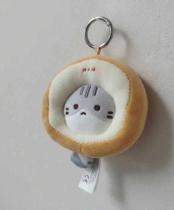 Toast Cat mini plush keychain in a tan round costume